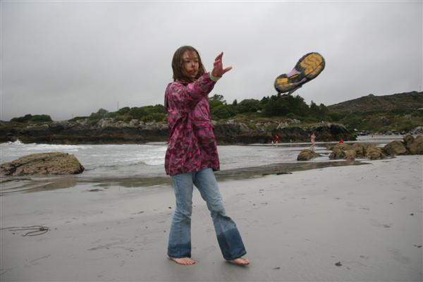 Jennifer tosses her shoes on White Strand beach at Castle Cove on the Iveragh Peninsula